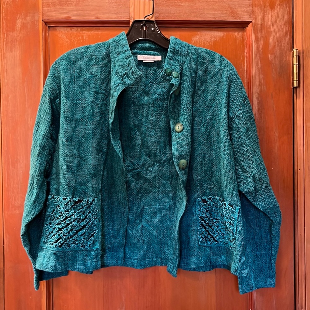 Teal cropped jacket. 100% cotton. Textured pockets and back design Sz medium